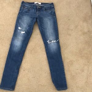 Hollister ripped skinny jeans.